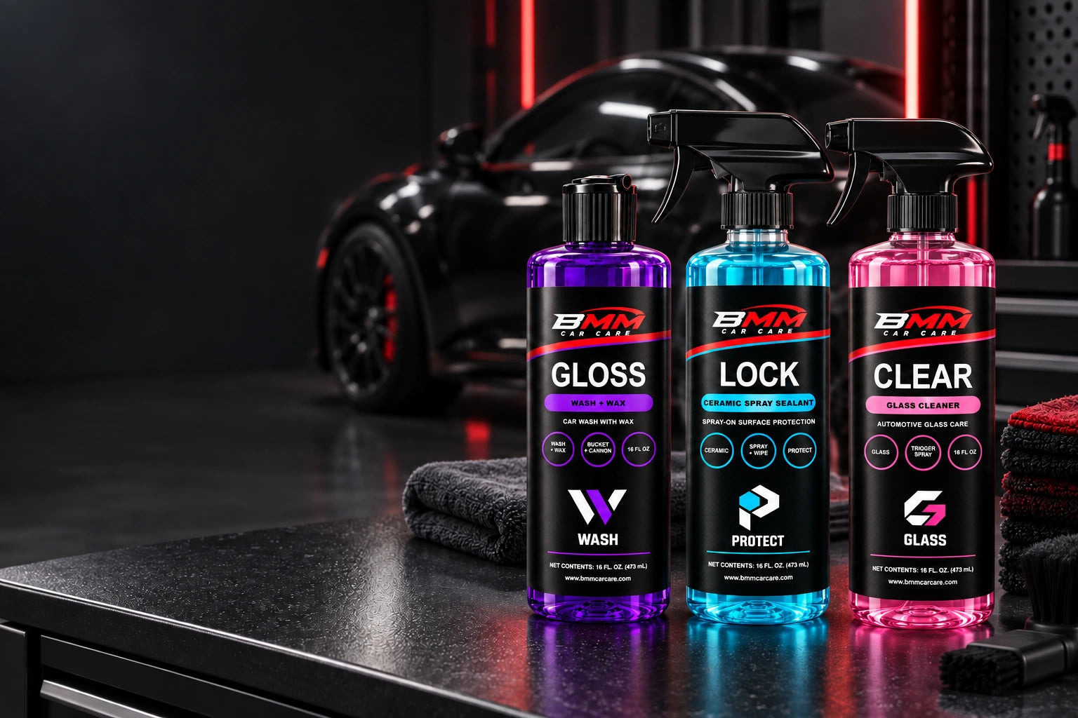 BMM GLOSS, LOCK and CLEAR car care with modern category monograms in a red-lit detailing garage